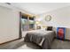 Cozy bedroom featuring a comfortable bed, large window, and cheerful decor at 24036 Currant Dr, Golden, CO 80401
