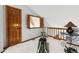 Versatile bonus room with a Total Gym and a unique shuttered window at 24036 Currant Dr, Golden, CO 80401