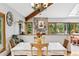 Bright dining room with a partial wall to the Gathering room and access to outside living spaces at 24036 Currant Dr, Golden, CO 80401