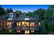 Back exterior elevation showing multiple decks for entertaining amid beautiful foliage and nature at 24036 Currant Dr, Golden, CO 80401