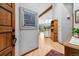 Bright foyer with hardwood floors, beamed ceilings, and stylish decor leads into an open living space at 24036 Currant Dr, Golden, CO 80401