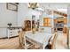 Bright kitchen and dining area with natural light, hardwood floors, and an open layout for entertaining at 24036 Currant Dr, Golden, CO 80401