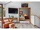Inviting living room with a comfortable leather chair and view into the bedroom at 24036 Currant Dr, Golden, CO 80401