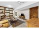 Living room with built in shelves, vintage desk and leather sofa at 24036 Currant Dr, Golden, CO 80401