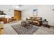 Basement living room with a large leather sofa and a vintage desk at 24036 Currant Dr, Golden, CO 80401