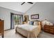 Comfortable main bedroom featuring a private balcony, and natural light at 24036 Currant Dr, Golden, CO 80401