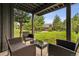 Covered patio area with comfortable seating and views of the backyard at 24036 Currant Dr, Golden, CO 80401