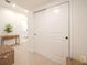 Bright hallway with closet space, neutral colors, and a view to the bathroom creates an open and inviting transition at 3439 W 154Th Ave, Broomfield, CO 80023