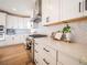 Modern kitchen featuring white cabinets, stainless steel appliances, and beautiful backsplash at 3439 W 154Th Ave, Broomfield, CO 80023