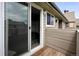 Cozy balcony with wood floors and sliding glass doors offering indoor-outdoor living at 3100 S Federal Blvd # 331, Denver, CO 80236