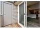 Balcony with open sliding glass door and storage area leading to the kitchen inside at 3100 S Federal Blvd # 331, Denver, CO 80236