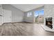 Bright living room with a fireplace, and access to a patio through sliding glass doors at 3100 S Federal Blvd # 331, Denver, CO 80236