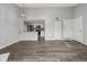 Spacious living room with modern flooring and an open layout into the kitchen at 3100 S Federal Blvd # 331, Denver, CO 80236