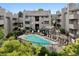 Community pool is surrounded by lush landscaping and seating areas for relaxation and enjoyment at 3100 S Federal Blvd # 331, Denver, CO 80236