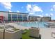 Resort-style community pool with lounge chairs and modern architecture at 762 N Rome St, Aurora, CO 80018