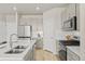 Bright kitchen featuring stainless steel appliances and a spacious kitchen island at 762 N Rome St, Aurora, CO 80018