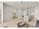 Spacious living room featuring a dining area, kitchen island, and open floor plan at 762 N Rome St, Aurora, CO 80018