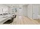 Open concept living area with a kitchen island and a bright sitting area at 762 N Rome St, Aurora, CO 80018