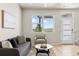 Bright living room with a large window that offers a view of the neighborhood at 762 N Rome St, Aurora, CO 80018