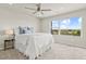 Bright main bedroom with a large window offering scenic views, plush carpeting, and a comfortable bed at 762 N Rome St, Aurora, CO 80018