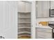 A walk-in pantry with built-in shelving provides ample storage at 762 N Rome St, Aurora, CO 80018