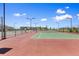 Well-maintained tennis courts in the community with lampposts and secure fencing at 762 N Rome St, Aurora, CO 80018