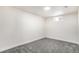 Finished basement bedroom with neutral wall colors and carpet at 5565 W Arizona Ave, Lakewood, CO 80232