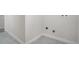 Unfinished basement laundry area with tile floor at 5565 W Arizona Ave, Lakewood, CO 80232
