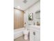 Modern bathroom with a walk-in shower, bathtub and white vanity at 5565 W Arizona Ave, Lakewood, CO 80232