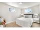 Spacious bedroom with a queen-size bed and light wood floors at 5565 W Arizona Ave, Lakewood, CO 80232