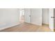 Cozy bedroom with light walls and wood-look flooring at 5565 W Arizona Ave, Lakewood, CO 80232