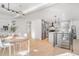 Bright dining area with wood table and modern light fixture at 5565 W Arizona Ave, Lakewood, CO 80232