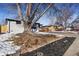 House exterior showcasing landscaping and a tree at 5565 W Arizona Ave, Lakewood, CO 80232