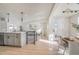 Open floor plan with modern kitchen and living room area at 5565 W Arizona Ave, Lakewood, CO 80232