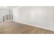 Spacious living room with light walls and wood-look flooring at 5565 W Arizona Ave, Lakewood, CO 80232