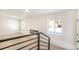 Open living area with a modern electric fireplace and light wood floors at 5565 W Arizona Ave, Lakewood, CO 80232