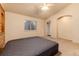 Large bedroom with vaulted ceilings and arched entryway to an ensuite bathroom at 250 Upper Forest Rd, Idaho Springs, CO 80452