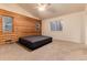 Spacious bedroom featuring log walls, neutral carpet and plentiful natural light at 250 Upper Forest Rd, Idaho Springs, CO 80452