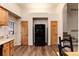 Bright kitchen showcasing a stainless steel fridge surrounded by wood doors and cabinets at 250 Upper Forest Rd, Idaho Springs, CO 80452