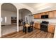 Open concept kitchen with wood cabinets overlooking living room at 250 Upper Forest Rd, Idaho Springs, CO 80452