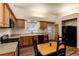 Kitchen features wood cabinets, granite countertops, and black appliances at 250 Upper Forest Rd, Idaho Springs, CO 80452