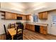 Bright kitchen features wood cabinets, granite countertops, and black appliances at 250 Upper Forest Rd, Idaho Springs, CO 80452