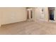 A spacious living room with neutral colored walls and carpeting provides a blank canvas at 250 Upper Forest Rd, Idaho Springs, CO 80452