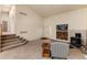 Bright living room features a staircase, wood burning stove, and fireplace at 250 Upper Forest Rd, Idaho Springs, CO 80452