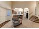 Open-concept living area with vaulted ceilings and view into the kitchen at 250 Upper Forest Rd, Idaho Springs, CO 80452