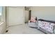 Well-lit Bedroom with a crib, rocking chair, and plush carpeting at 529 Beckwourth, Fort Lupton, CO 80621