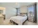 Bedroom featuring natural light and stylish accents like decorative lamps and patterned curtains at 529 Beckwourth, Fort Lupton, CO 80621
