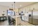 A cozy kitchen with a breakfast bar island and stainless steel appliances at 529 Beckwourth, Fort Lupton, CO 80621