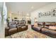 Open-concept living room with hardwood floors, recessed lighting, and a seamless flow into the kitchen at 529 Beckwourth, Fort Lupton, CO 80621