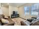 Comfortable living room with natural light, stylish furnishings, and modern entertainment center at 529 Beckwourth, Fort Lupton, CO 80621